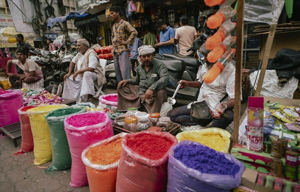 Vendor sells Holi celebration items in a street market, ahead of Holi festival on March 23, 2024 in