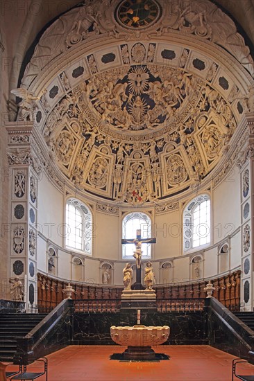 Interior view of the west choir with ceiling fresco, baptismal font and crucifix from UNESCO St