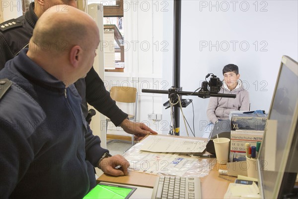 A fugitive is photographed at the Federal Police in Passau during the identification procedure,