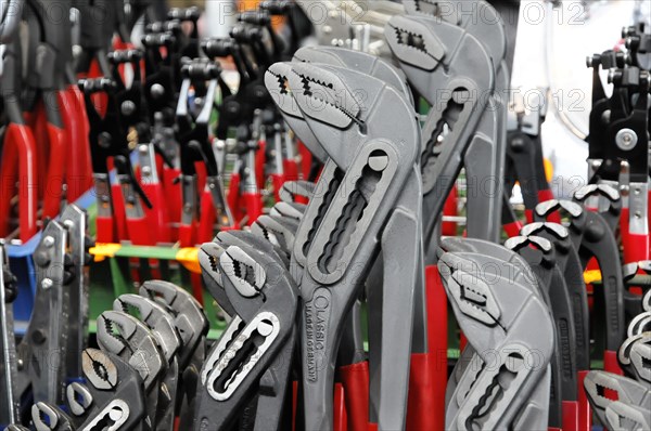 RETRO CLASSICS 2010, Stuttgart Messe, Several pliers in grey, black and red, organised in a row on