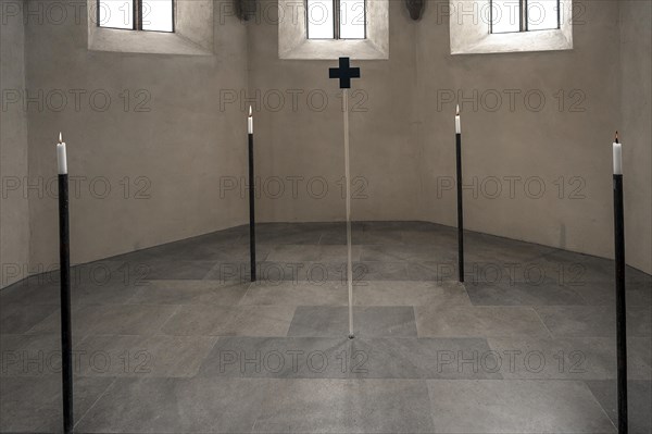4 candles and a glass cross at the former altar site, St Clare's Church, Koenigstrasse 66,
