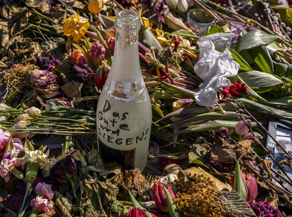 Mourners with flags and flowers in front of the Russian Embassy Unter den Linden, Berlin, Germany,