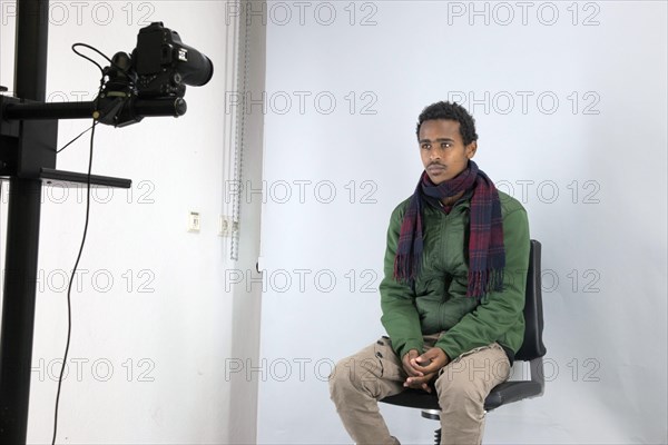 A fugitive is photographed at the Federal Police in Passau during the identification procedure,