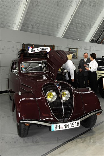 RETRO CLASSICS 2010, Stuttgart Messe, A well-kept dark red classic vintage car with open bonnet and