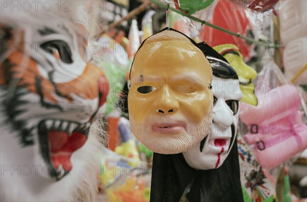 Vendor sells Holi celebration items in a street market, ahead of Holi festival on March 23, 2024 in