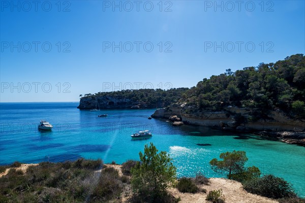 Private boats anchored in the bay in front of Playa El Mago, Cala de Portals Vells, Majorca,