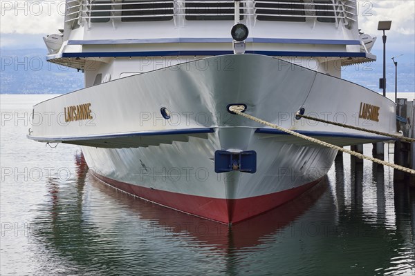Passenger ship Lausanne lies in Lake Geneva and is moored with her bow with two thaws in the