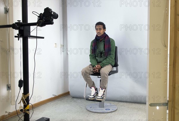 A fugitive is photographed at the Federal Police in Passau during the identification procedure,