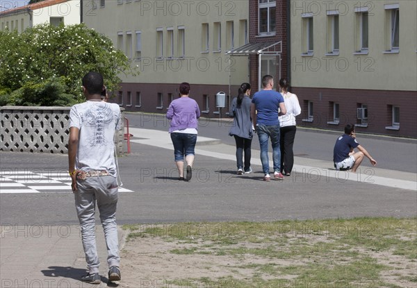 Refugees at the central contact point for asylum seekers in the state of Brandenburg in