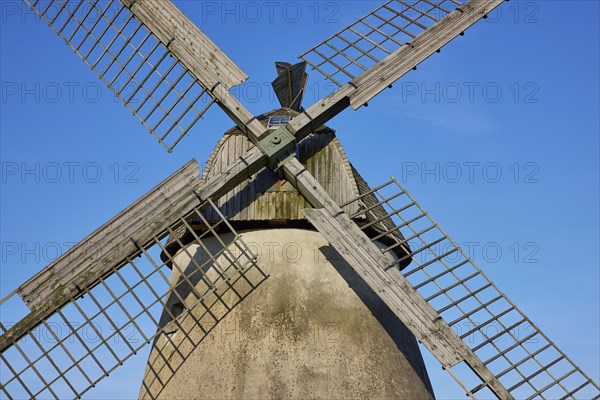 Wings of the windmill Auf der Hoechte under a cloudless blue sky in Hille, Muehlenkreis