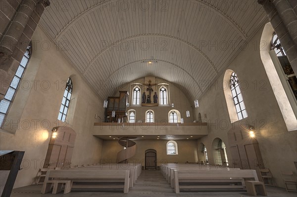 Interior with view to the west side with gallery and crucifixion group, St Clare's Church,