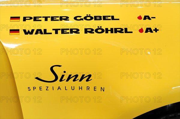 RETRO CLASSICS 2010, Stuttgart Messe, A yellow car with the names Peter Goebel and Walter Roehrl