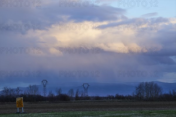 Weather change with mighty light to grey-blue clouds illuminated by the evening sun over the Black