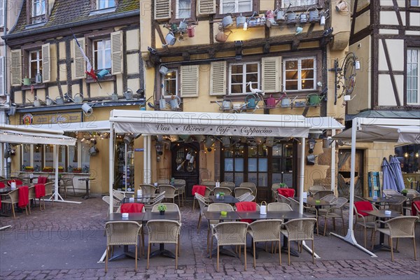 Catering establishments in historic half-timbered houses with watering cans decorating the facade