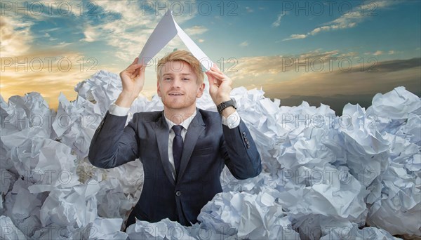 A man in a suit holds a paper aeroplane over a sea of crumpled papers, symbol bureaucracy, AI