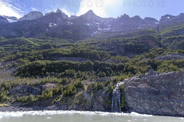 Waterfall, floating ice, mountain range, Andes, Lago Grey, Torres del Paine National Park, Parque