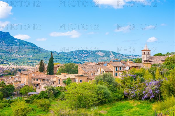 Southern village of Biniaraix with small church, houses, buildings, view towards Soller, rural