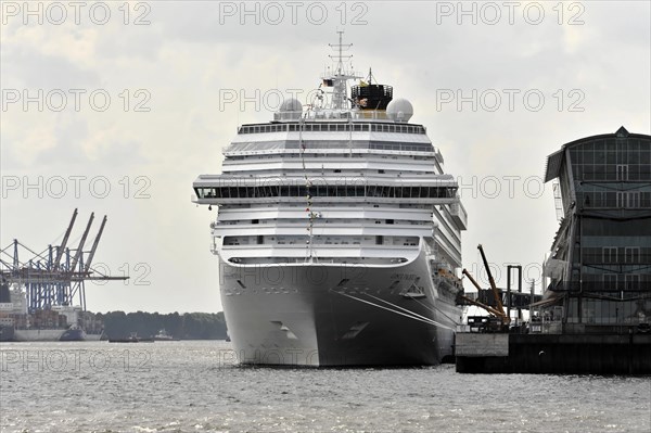 COSTA PACIFICA, Large cruise ship in the harbour with container cranes in the background on a