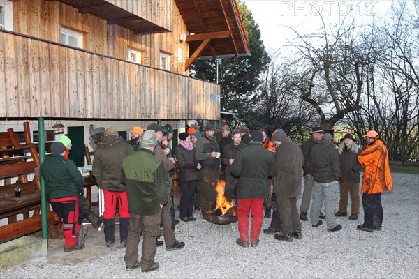 Wild boar (Sus scrofa) end of the hunt, amusing hunter's round, so-called Schuesseltreiben,