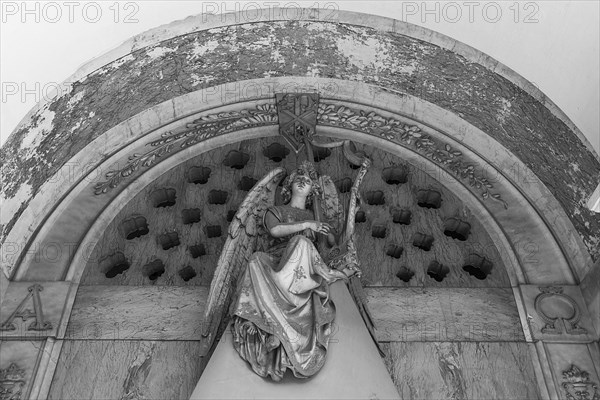 Angel sculpture on a family tomb, Monumental Cemetery, Cimitero monumentale di Staglieno), Genoa,