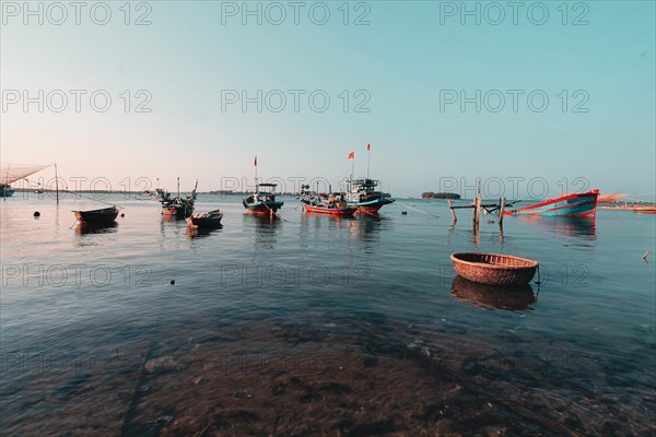 Scenic view of traditional Vietnamese fishing boats in Phan Thiet fishing village in Mui Ne,