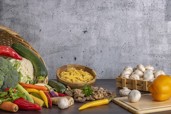 Various fresh vegetables such as peppers, cauliflower, peppers, mushrooms and broccoli around and