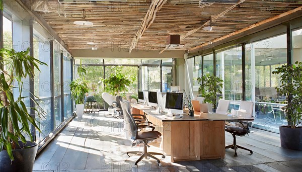 Office with glass facade and warm wooden elements in a naturally sunlit space, Symbol office, AI