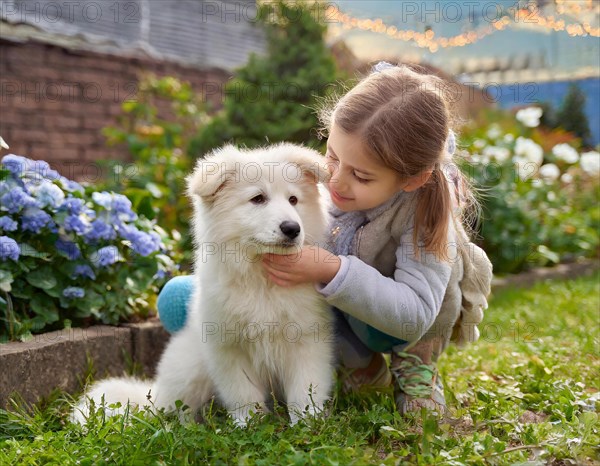 Dog, puppies of a white shepherd dog playing with a five-year-old girl in the garden, AI generated,