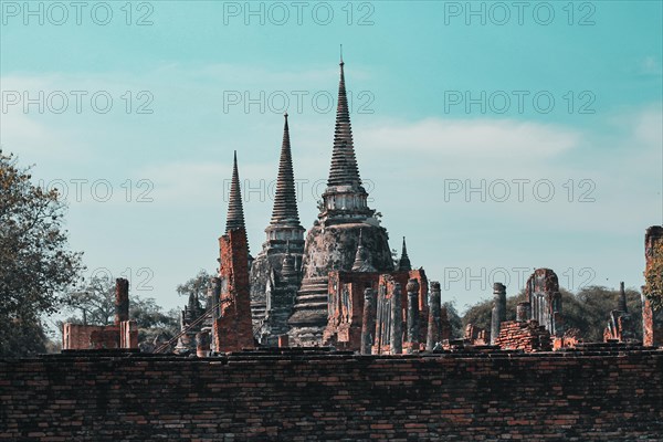 Old ruins in Wat Mahathat inside the famous heritage site of Ayutthaya Historical Park in Thailand.