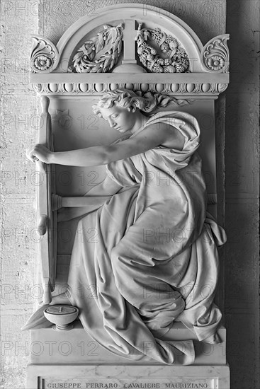 Sculpture of a woman with a ship's steering wheel, Monumental Cemetery, Cimitero monumentale di