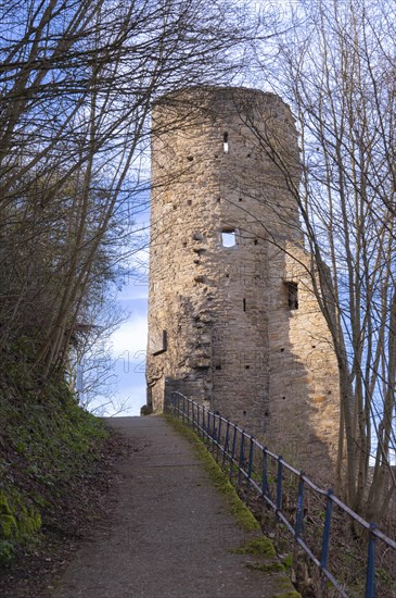 Steep path with blue railings from the castle hotel up to the ruins of Volmarstein Castle, remains