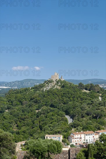 Landscape with the castle of Grimaud, in the background the hills of the Massif des Maures,