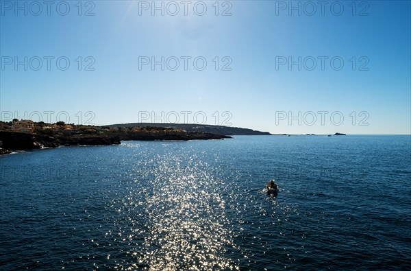 View of the sea with fishing boat from the Mirador de les Malgrats near Santa Ponca or Santa Ponsa,