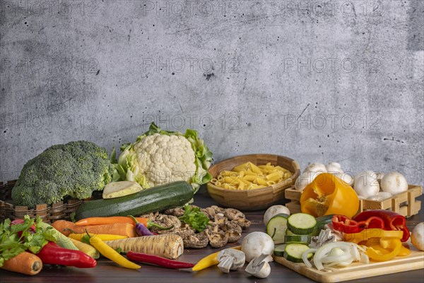 Various fresh vegetables such as peppers, cauliflower, peppers, mushrooms, broccoli and pasta next