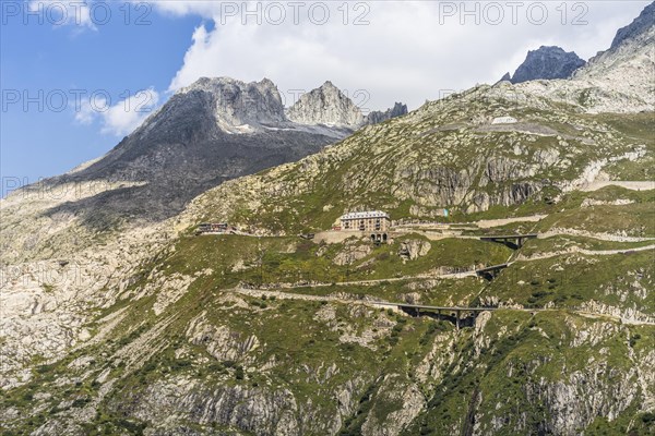 View of the serpentines of the Furka Pass road and the famous Hotel Belvedere, Obergoms, Canton