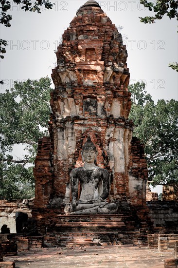 Ancient temple ruins in Wat Choeng Tha, part of the famous Ayutthaya Historical Park in Thailand.