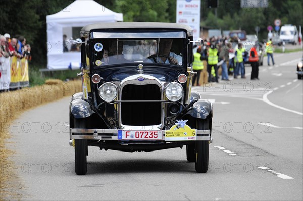 Ford Model A, year of construction 1929, A black Ford Cabriolet vintage car drives in a race with