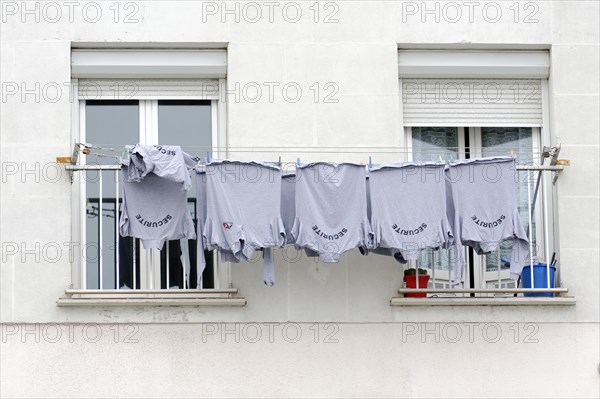 Marseille, Blue T-shirts on a washing line outside the window, Marseille, Departement