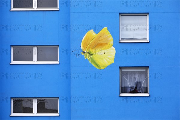 Sunflower house, painted yellow lemon butterfly on a skyscraper, artist Ulrich Allgaier, Wuppertal,
