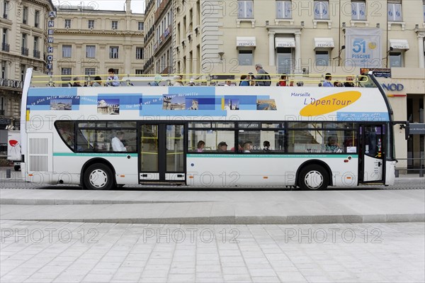 Marseille, sightseeing bus with passengers travelling through the city streets, Marseille,