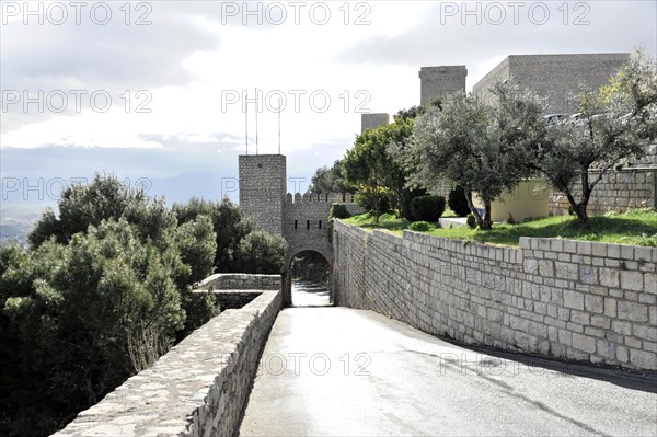 Path to the Gothic castle Castillo de Santa Catalina, Jaen, Jaen province, stone fortress with