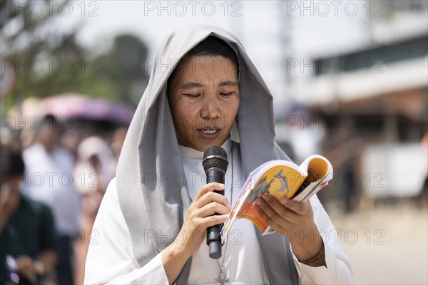 Christian devotees takes part in a perform to re-enactment of the crucifixion of Jesus Christ