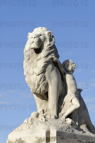 Marseille, White marble sculpture of a lion and a woman in front of a blue sky, Marseille,