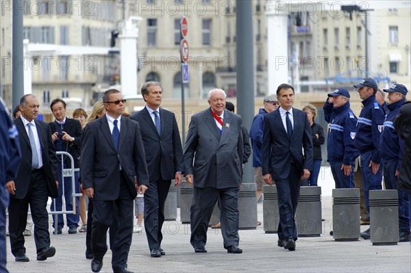 Marseille City Hall, A group of people in official dress walk past police officers, Marseille,