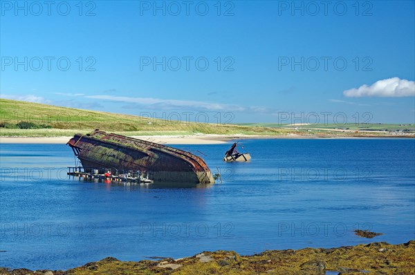 Parts of sunken ships sticking out of the water, Churchill Barriers, 2nd World War, Orkney Islands,