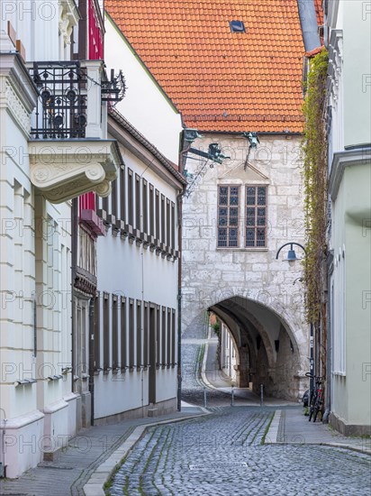 Archway at the town hall in the historic old town, alley with cobblestones, Muehlhausen, Thuringia,