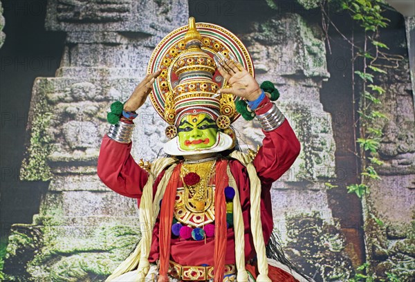 Kathakali performer or mime, 38 years old, on stage at the Kochi Kathakali Centre, Kochi, Kerala,