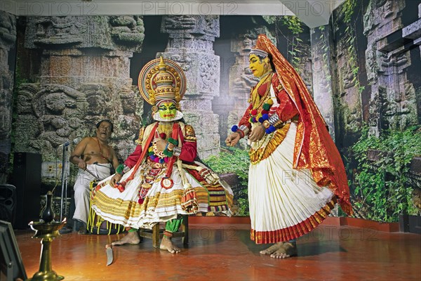 Kathakali performer or mime, 38 and 60 years old, and drummer on stage at the Kochi Kathakali