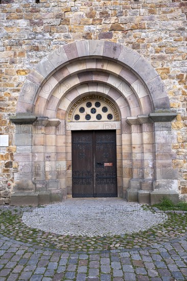 Slogan All and in all Christ above a door of St Mary's Cathedral, Havelberg, Saxony-Anhalt,