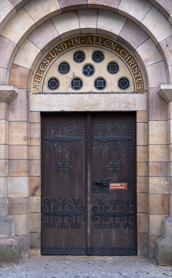 Slogan All and in all Christ above a door of St Mary's Cathedral, Havelberg, Saxony-Anhalt,